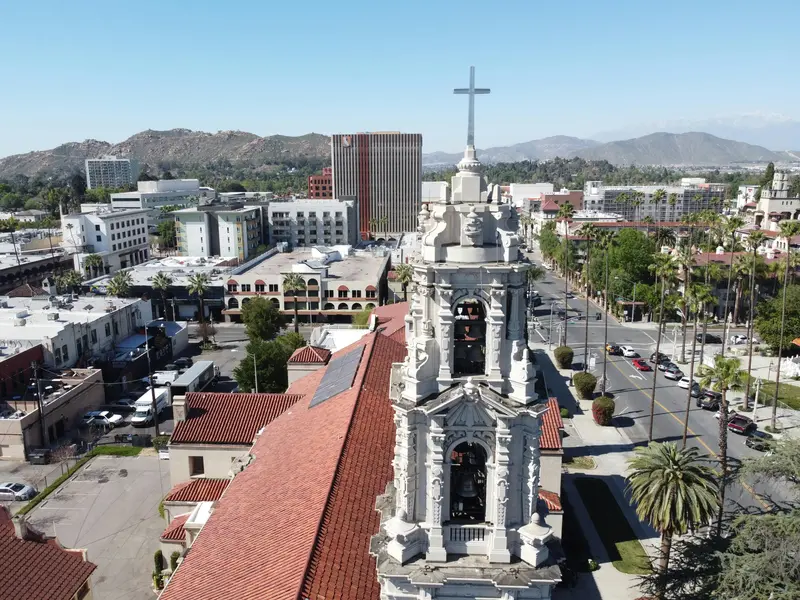 Aerial view of downtown Riverside California showing historic Mission Inn and business district at golden hour